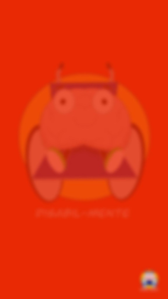 È un’immagine con sfondo rosso e con al centro un cerchio giallo e una sedia a rotelle con qualcosa sopra che non si capisce bene cosa sia perché è sfuocata. Sotto la sedia a rotelle c’è una piccola scritta in orizzontale.